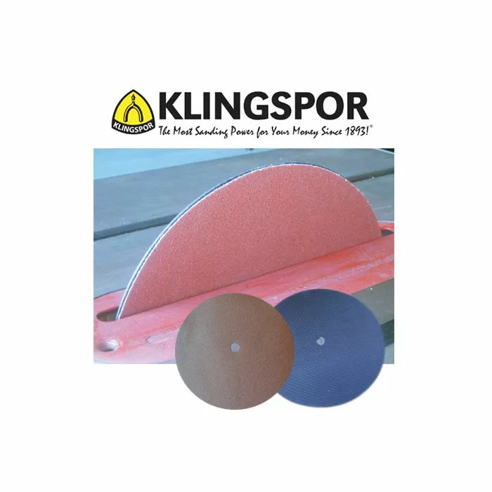 Round sanding discs for woodworking, mounted on a disc sander with two additional pads.