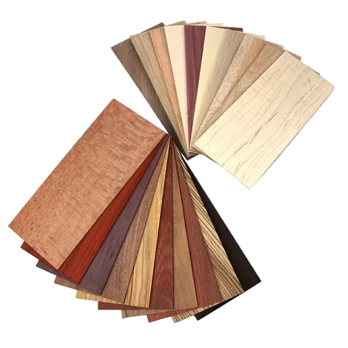 Variety of hardwood veneer sample sheets fanned out for woodworking projects