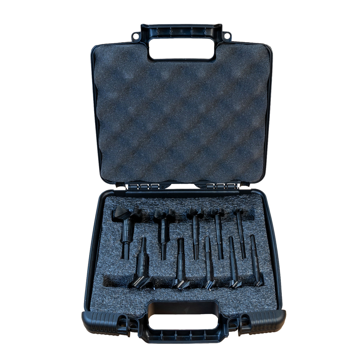 Black tool case with compartments holding Famag forstner bits on a white background