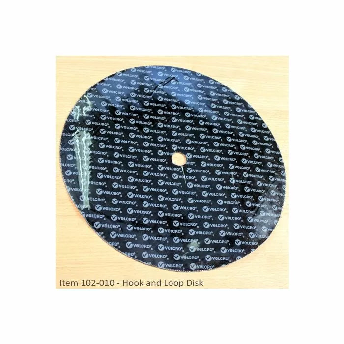 Hook and loop Velcro disk with center hole for woodworking tool accessories on wood surface