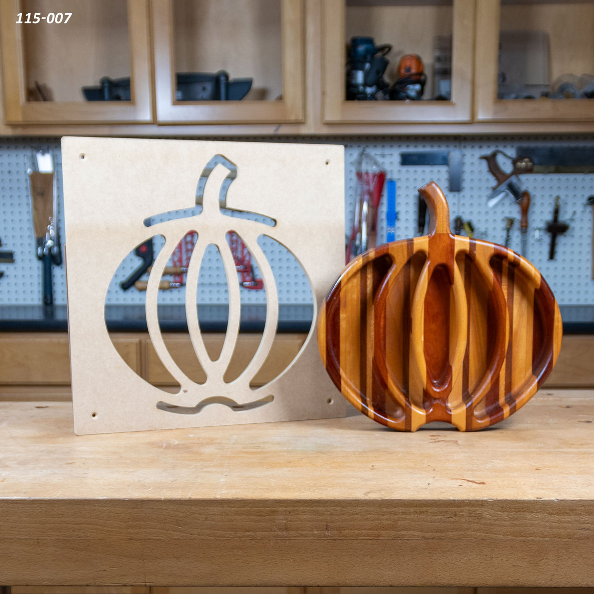 Pumpkin tray woodworking template and finished wooden pumpkin-shaped serving tray on workbench