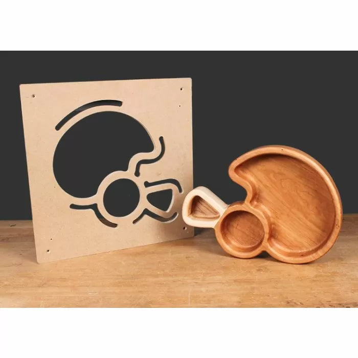 Wooden serving tray with matching MDF template for woodworking, on a workbench