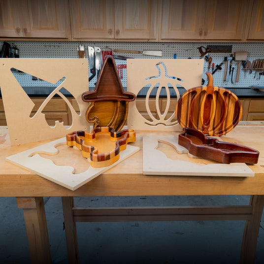 Halloween tray making templates and finished wooden trays in witch, pumpkin, coffin, and bat shapes
