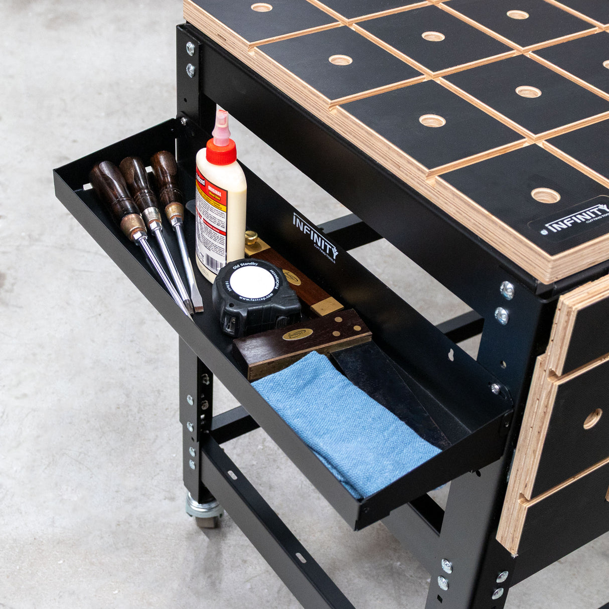 Workbench with tools and supplies on a concrete floor