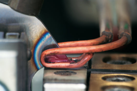Close-up of carbide teeth being braised onto a saw body.