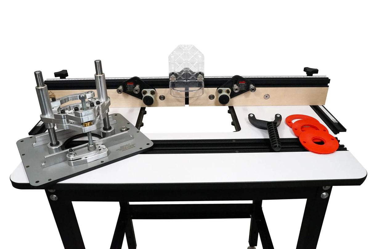 Router table package with lift mechanism, fence, inserts, and wrench on workbench