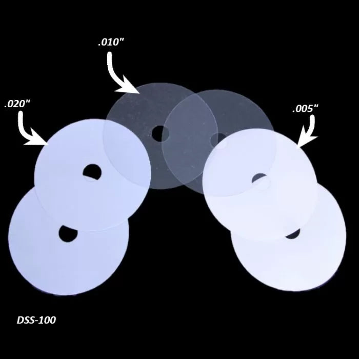 Clear plastic disc shims in 0.020, 0.010, and 0.005 inch thicknesses for woodworking tools