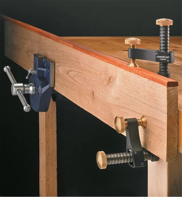 Woodworking bench with vise and clamping tools for precise woodwork and secure holding
