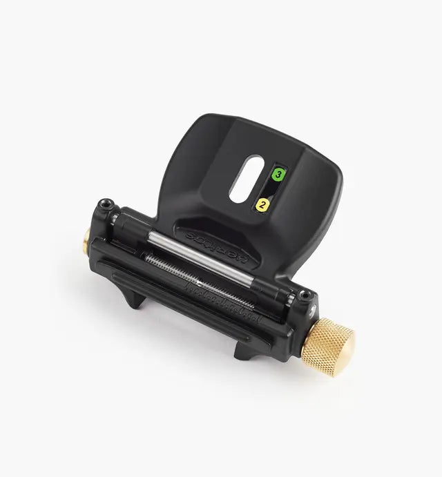 Precision woodworking honing guide tool with black body and brass adjustment knob