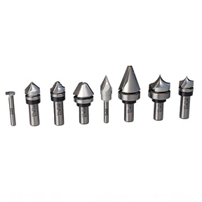 Assorted woodworking router bits set with various cutting profiles on white background