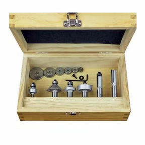 Woodworking router bit set in open wooden case with multiple bits and accessories