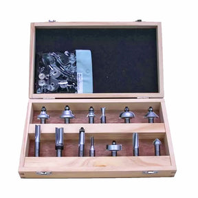 Wood router bit set in open wooden box with multiple bits and accessories for woodworking.