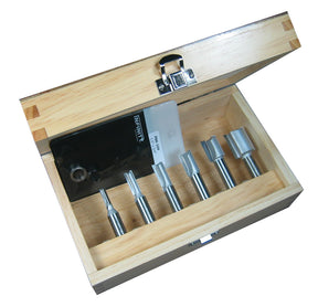 Wood router bit set in open wooden case with five straight router bits displayed