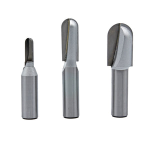 Set of three carbide-tipped router bits for woodworking, isolated on white background