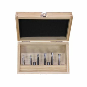 Woodworking router bit set in open wooden case, precision tools for cutting and shaping wood