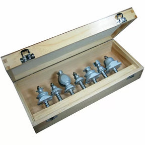 Woodworking router bit set with six bits in a wooden storage case