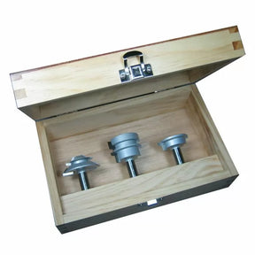 Wooden box with three metal router bit jigs for woodworking tool setup