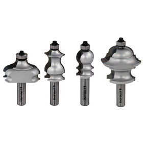 Set of four decorative carbide router bits for woodworking on white background