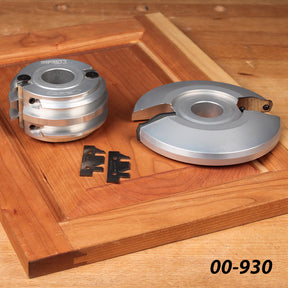 Cabinet door shaper cutter set with carbide knives on wooden panel for woodworking precision