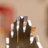 Closeup of ripping blade teeth.