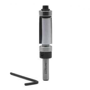 Carbide router bit with bearing and hex key for woodworking, isolated on white background.