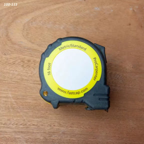 16-foot metric and standard tape measure for woodworking on a wooden surface