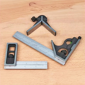 Set of precision woodworking squares and combination ruler on workbench surface