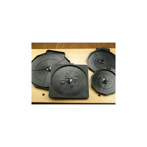 Set of four black router bit storage trays on a wooden workbench for woodworking tools