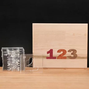Woodworking template set and wood panel with inlaid numbers 1 2 3, on wood table