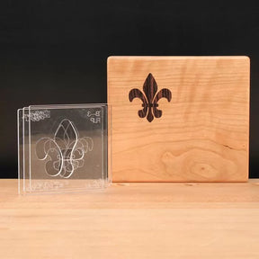 Fleur-de-lis inlay woodworking template set and finished wooden inlay on maple block
