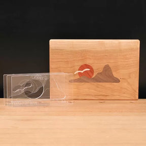 Acrylic inlay templates and a wooden board featuring a mountain and sun woodworking inlay design