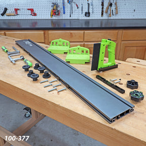 Woodworking track saw guide rail system with clamps and accessories on workbench