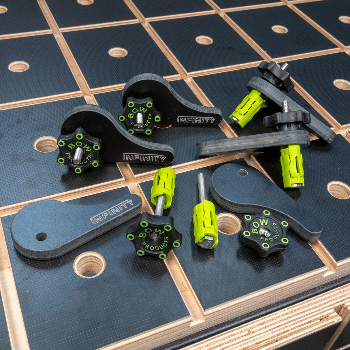 Eccentric cam clamp set with knobs and hardware on woodworking worktop
