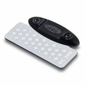 Diamond sharpening stone with textured surface and black handle, labeled DC-300, for woodworking.