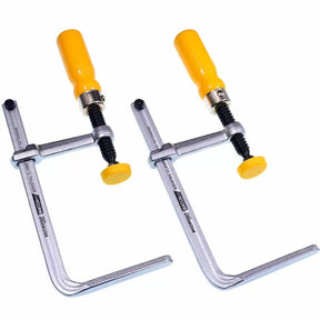 Pair of heavy-duty F-style woodworking clamps with yellow handles on white background