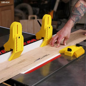 Woodworker using table saw with yellow featherboards and push block for safety and precision