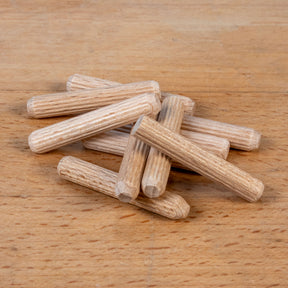 Wooden dowels on a wooden surface
