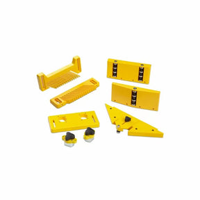 Yellow woodworking router table accessories set with featherboards, guides, and hold-downs