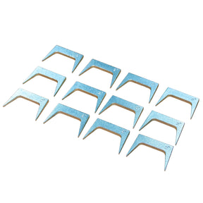 Set of twelve metal pinch dogs for woodworking on a white background