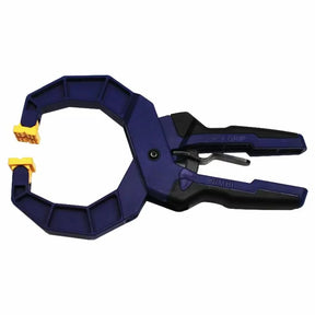 Blue plastic quick-grip woodworking clamp with yellow pads for secure holding