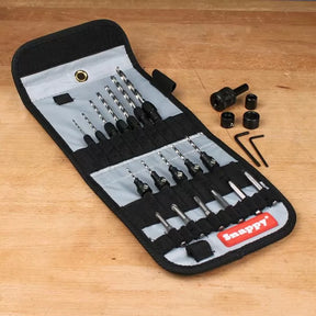 Woodworking drill and driver bit set in a foldable case on a workbench