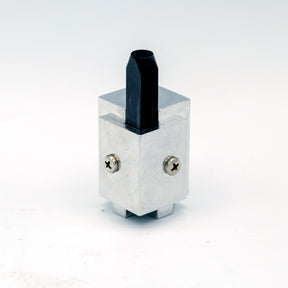 Squared corner chisel with metal body and black blade on white background, woodworking tool