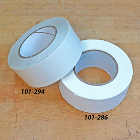 Double-sided woodworking tape rolls on a workbench, labeled 101-294 and 101-286.