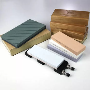 Sharpening stones and wooden storage boxes for woodworking tools, displayed on a white background.