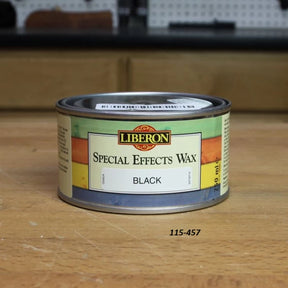 Liberon Special Effects Wax Black 250ml can on a woodworking bench