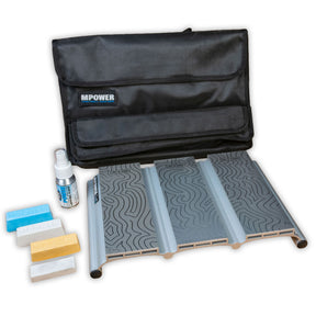 Woodworking sharpening kit with patterned stones, color honing blocks, spray bottle, and black storage pouch