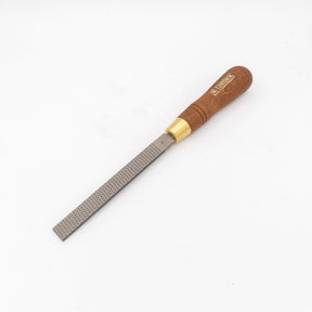 Woodworking rasp with wooden handle and fine steel teeth for shaping wood