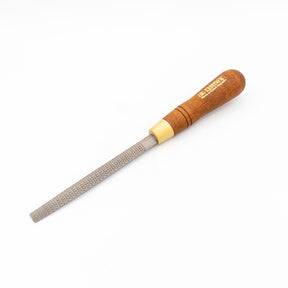 Woodworking hand rasp with wooden handle and fine metal teeth on white background