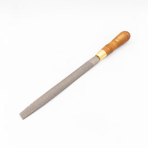 Woodworking hand rasp with wooden handle and textured steel file on white background