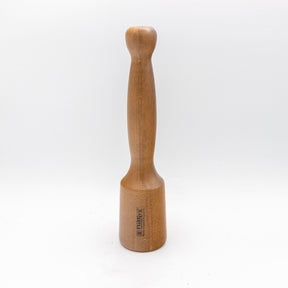 Wood carver's mallet with smooth handle and engraved logo on white background